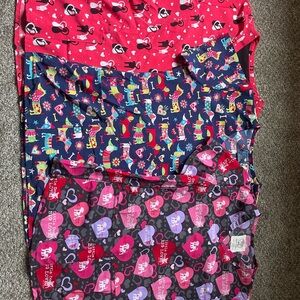 Assorted animal print scrub tops